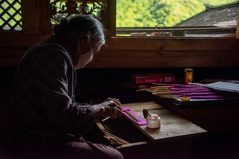 Photo: Making Joss Sticks, by Rod Waddington
