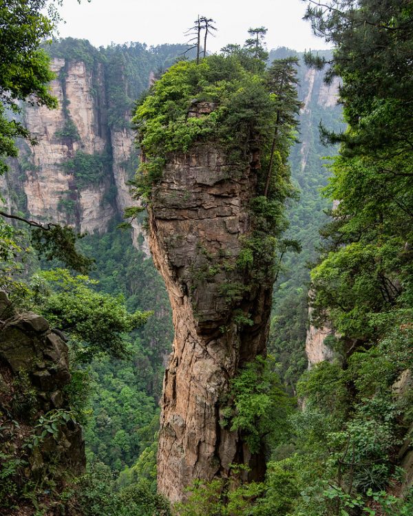 A lone pillar-shaped outcropping topped with several trees stands out among the peaks of Heavenly Pillar in Zhangjiajie National Forest Park, in northwest Hunan Province. The mountains of Heavenly Pillar reportedly inspired the Hallelujah Mountains in the film “Avatar.”