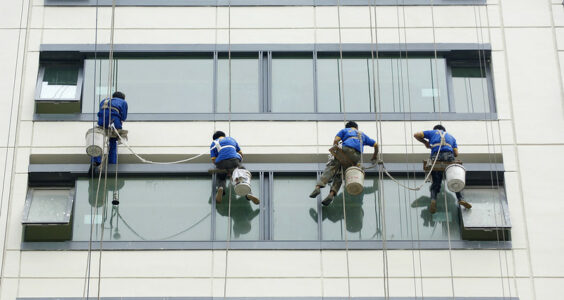 Photo: Untitled (Migrant Workers Washing Windows in Beijing), by Crozet M. / ILO